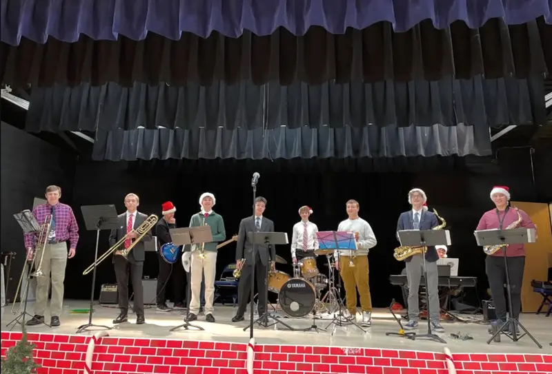 Scholarsjazz members in Santa hats after a holiday concert